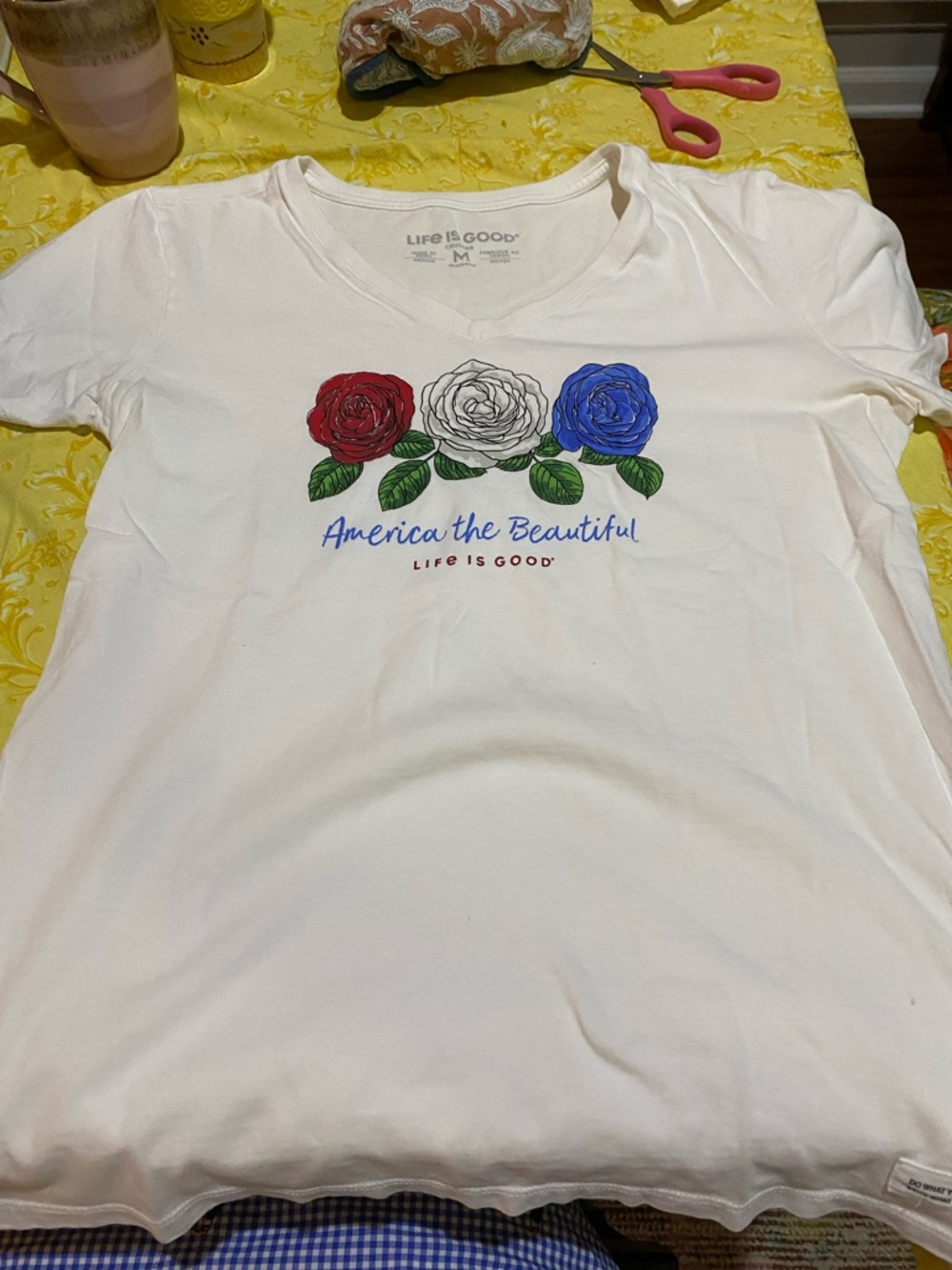 Celebrate 250 years of America!  NWOT Life Is Good Woman’s Tee. 3 Roses Red, W&B